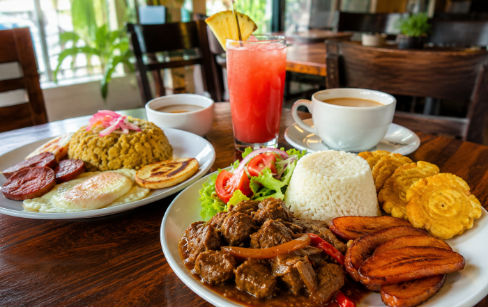 Dominican cooking with slow-cooked meats, seasoned rice, crispy plantains, savory breakfast favorites, and refreshing drinks